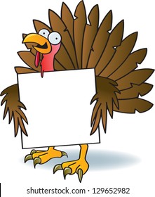 A silly turkey with crazy eyes holding a blank sign.