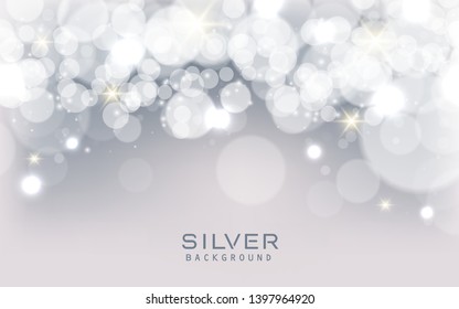 Silver abstract bokeh background sparkling lights effect. Blured circle on gray background.