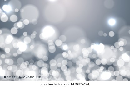 Silver abstract bokeh background sparkling lights effect. Blured circle on gray background.