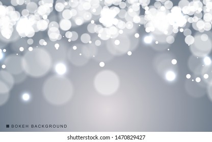 Silver abstract bokeh background sparkling lights effect. Blured circle on gray background.