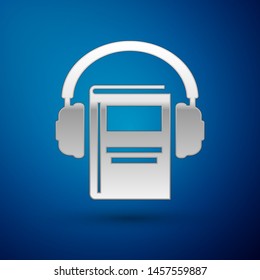 Silver Audio book icon isolated on blue background. Book with headphones. Audio guide sign. Online learning concept.  Vector Illustration