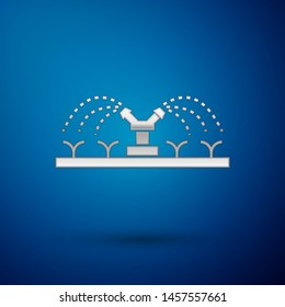 Silver Automatic irrigation sprinklers icon isolated on blue background. Watering equipment. Garden element. Spray gun icon.  Vector Illustration