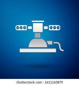 Silver Automatic irrigation sprinklers icon isolated on blue background. Watering equipment. Garden element. Spray gun icon.  Vector Illustration