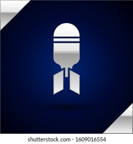 Silver Aviation bomb icon isolated on dark blue background. Rocket bomb flies down.  Vector Illustration