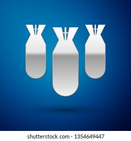Silver Aviation bombs icon isolated on blue background. Rocket bomb flies down. Vector Illustration