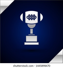 Silver Award cup and American football ball icon isolated on dark blue background. Winner trophy symbol. Championship or competition trophy. Vector Illustration Silver Award cup and American football ball icon isolated on dark blue background. Winner trophy symbol. Championship or competition trophy. Vector Illustration