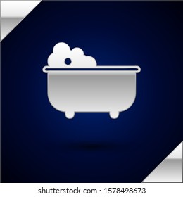 Silver Baby bathtub with foam bubbles inside icon isolated on dark blue background.  Vector Illustration