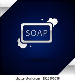 Silver Bar of soap with foam icon isolated on dark blue background. Soap bar with bubbles.  Vector Illustration