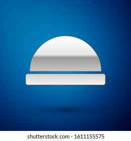 Silver Beanie hat icon isolated on blue background.  Vector Illustration