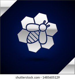 Silver Bee and honeycomb icon isolated on dark blue background. Honey cells. Honeybee or apis with wings symbol. Flying insect. Sweet natural food.  Vector Illustration