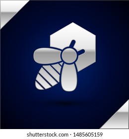 Silver Bee and honeycomb icon isolated on dark blue background. Honey cells. Honeybee or apis with wings symbol. Flying insect. Sweet natural food.  Vector Illustration