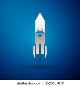 Silver Biohazard rocket icon isolated on blue background. Rocket bomb flies down.  Vector Illustration