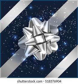 Silver And Blue Christmas Bow With Confetti On Gift Box