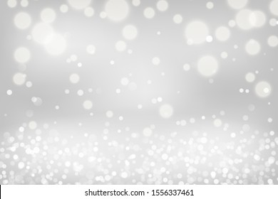 Silver bokeh background. Christmas glowing lights with sparkles. Holiday decorative effect.