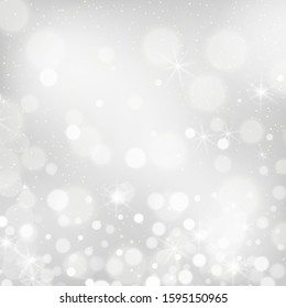 Silver bokeh background. Christmas glowing lights with sparkles. Holiday decorative effect.