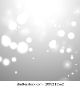 Silver Bokeh Christmas Background. Snow Flakes on Light Grey. Blurred Vector Design. Holiday Winter Backdrop With Glow and Overlay Effect. Season Bling Christmas Decoration.