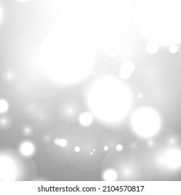 Silver Bokeh Christmas Background. Snow Flakes on Light Grey. Blurred Vector Design. Holiday Winter Backdrop With Glow and Overlay Effect. Season Bling Christmas Decoration.