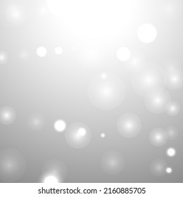 Silver Bokeh Christmas Background. Snow Flakes on Light Grey. Blurred Vector Design. Holiday Winter Backdrop With Glow and Overlay Effect. Season Bling Christmas Decoration.