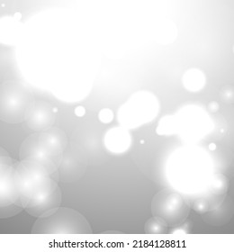Silver Bokeh Christmas Background. Snow Flakes on Light Grey. Blurred Vector Design. Holiday Winter Backdrop With Glow and Overlay Effect. Season Bling Christmas Decoration.