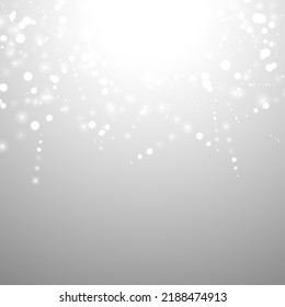 Silver Bokeh Christmas Background. Snow Flakes on Light Grey. Blurred Vector Design. Holiday Winter Backdrop With Glow and Overlay Effect. Season Bling Christmas Decoration.