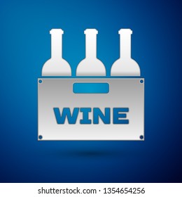 Silver Bottles of wine in a wooden box icon isolated on blue background. Wine bottles in a wooden crate icon. Vector Illustration