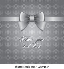 silver bow on gray vintage seamless background