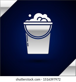 Silver Bucket with foam and bubbles icon isolated on dark blue background. Cleaning service concept.  Vector Illustration