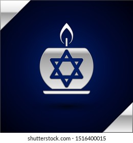 Silver Burning candle in candlestick with star of david icon isolated on dark blue background. Cylindrical candle stick with burning flame.  Vector Illustration