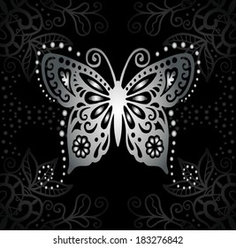 Silver butterfly on black background. Abstract decoration, lace pattern, detailed ornament, isolated elements