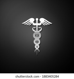 Silver Caduceus medical symbol icon isolated on black background. Medicine and health care concept. Emblem for drugstore or medicine, pharmacy snake. Long shadow style. Vector.
