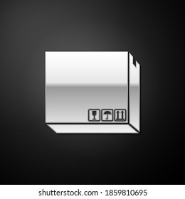 Silver Carton cardboard box with traffic symbols icon isolated on black background. Delivery and packaging. Transportation and shipping. Long shadow style. Vector.