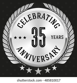 Silver celebrating 35 years badge, button on black background