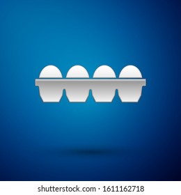 Silver Chicken egg in box icon isolated on blue background.  Vector Illustration
