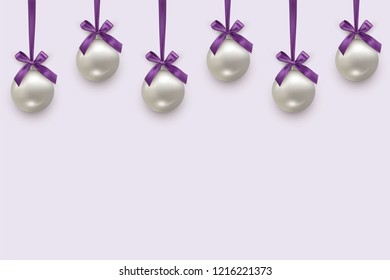 Silver Christmas balls with violet bows and ribbons isolated on light background. Vector Christmas and New Year background.