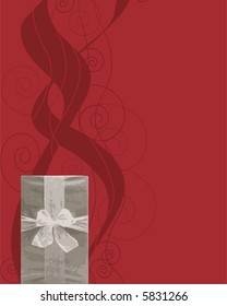 Silver Christmas gift against red background with swirls.