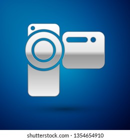 Silver Cinema camera icon isolated on blue background. Video camera. Movie sign. Film projector. Vector Illustration