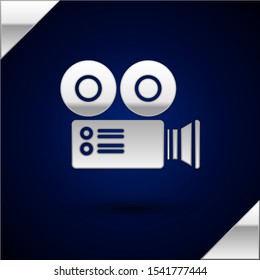 Silver Cinema camera icon isolated on dark blue background. Video camera. Movie sign. Film projector.  Vector Illustration