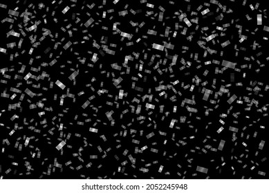 Confeti plateado sobre fondo negro