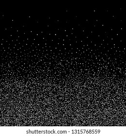 Silver confetti ribbons on the black background. Concept of happy birthday, party and holidays