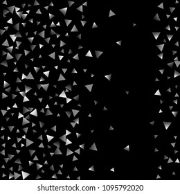Silver confetti triangle on a black background. Abstract celebration background in the form of a silver triangle. Decorative element. Suitable for your design, cards, invitations, gifts.