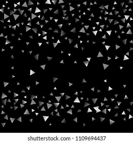Silver confetti triangle on a black background. Abstract celebration background in the form of a silver triangle. Decorative element. Suitable for your design, cards, invitations, gifts.
