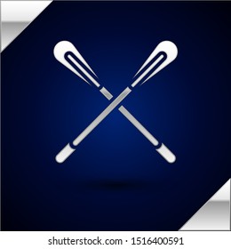 Silver Crossed paddle icon isolated on dark blue background. Paddle boat oars.  Vector Illustration