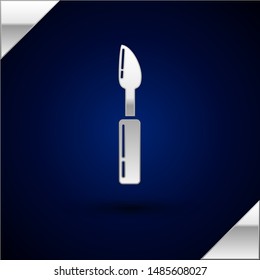 Silver Cutter tool icon isolated on dark blue background. Sewing knife with blade.  Vector Illustration