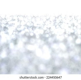 Silver defocused christmas background. Bright bokeh. Vector illustration.