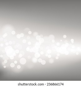Silver Defocused Lights - Vector illustration of silver defocused lights across a dark grey background.  