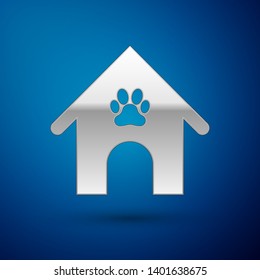 Silver Dog house and paw print pet icon isolated on blue background. Dog kennel. Vector Illustration