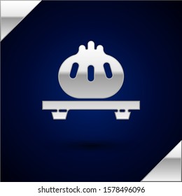 Silver Dumpling on cutting board icon isolated on dark blue background. Traditional chinese dish.  Vector Illustration