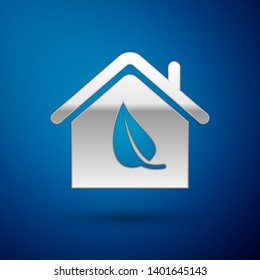 Silver Eco friendly house icon isolated on blue background. Eco house with leaf. Vector Illustration