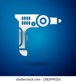 Silver Electric drill machine icon isolated on blue background. Repair tool.  Vector Illustration