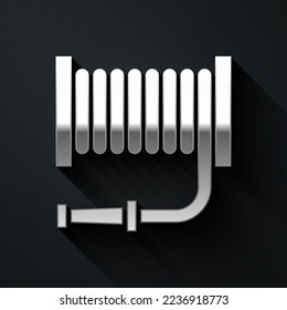 Silver Fire hose reel icon isolated on black background. Long shadow style. Vector